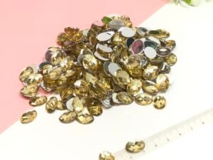 Pedraria Dourada -10x14 
15gramas -aprx 47unid